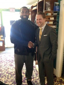Patriots All-Pro Jerod Mayo thanks Main Street Formals owner Robert Brunelle for preparing the formalwear for the wedding of Mayo's brother, Deron.